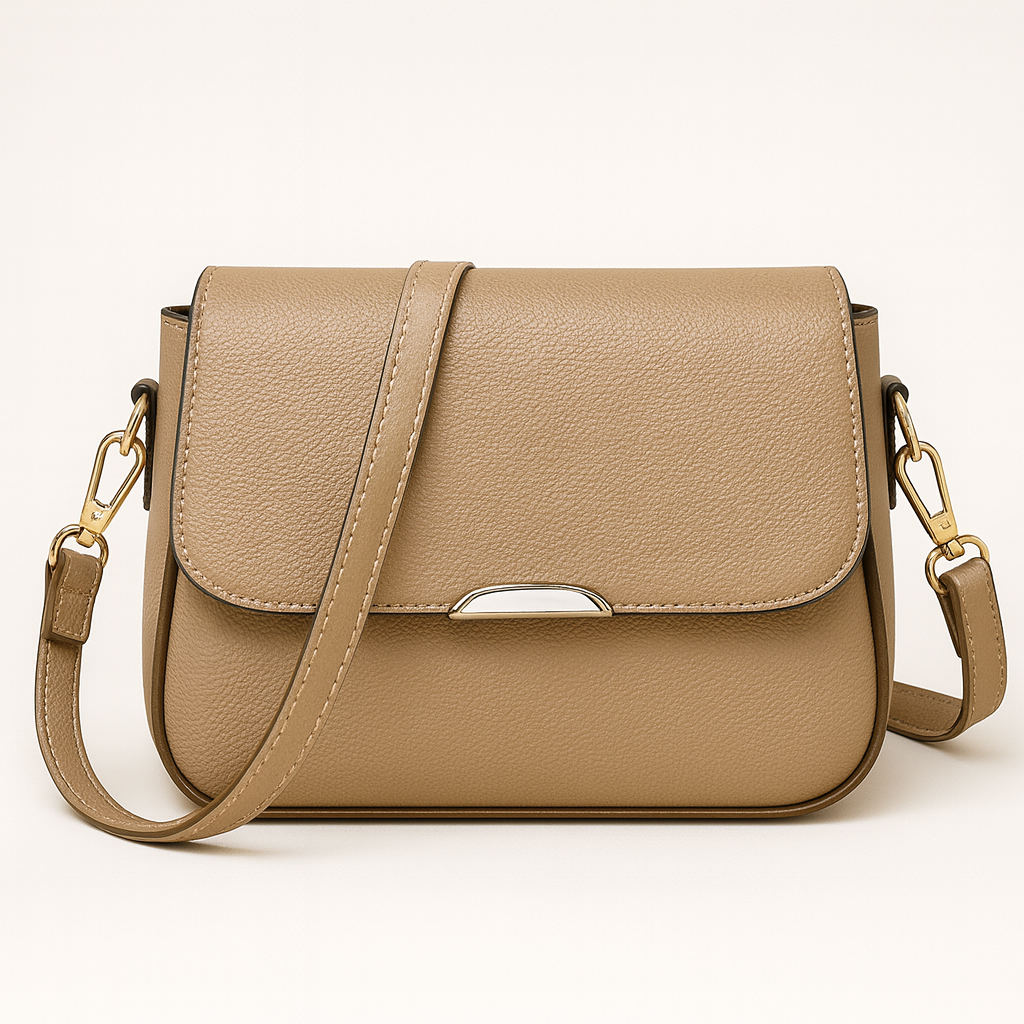 Crossbody bag with curved flap and slim shoulder strap.