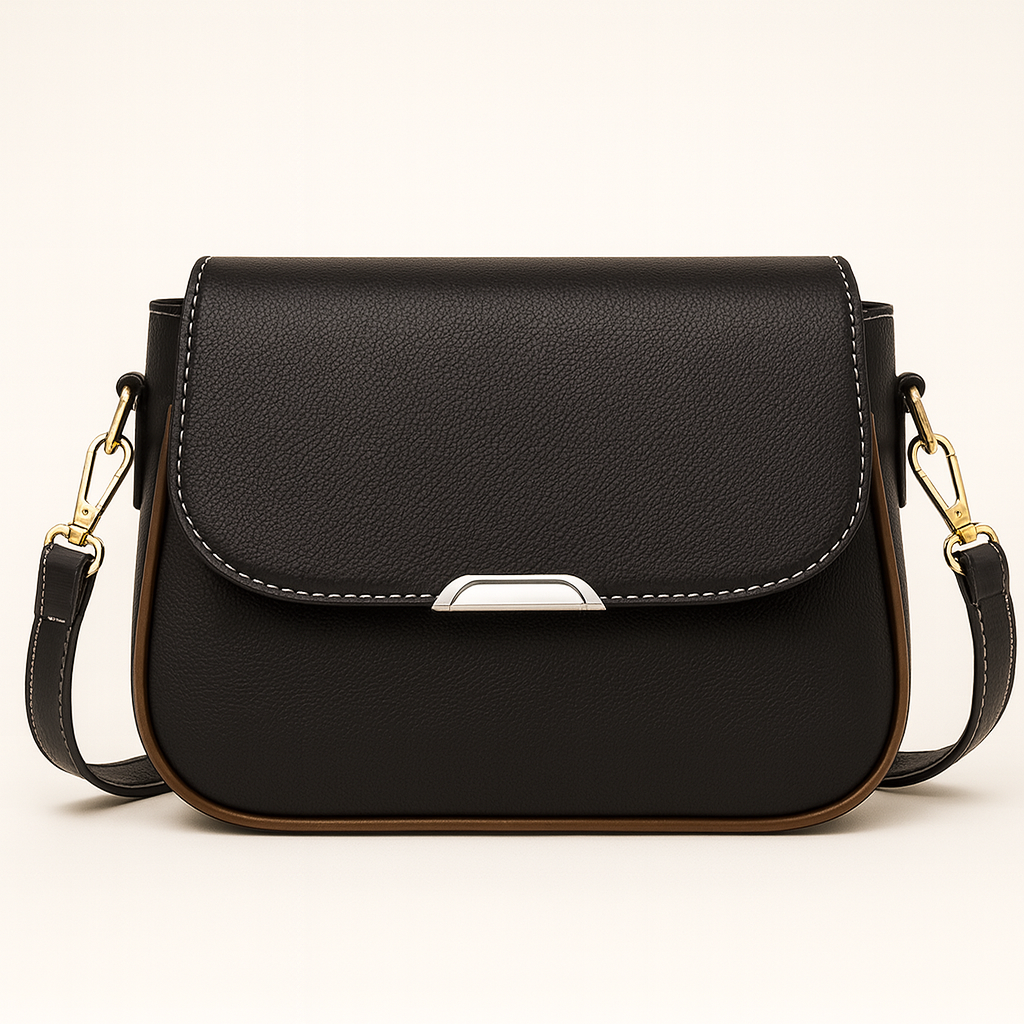 Crossbody bag with curved flap and slim shoulder strap.