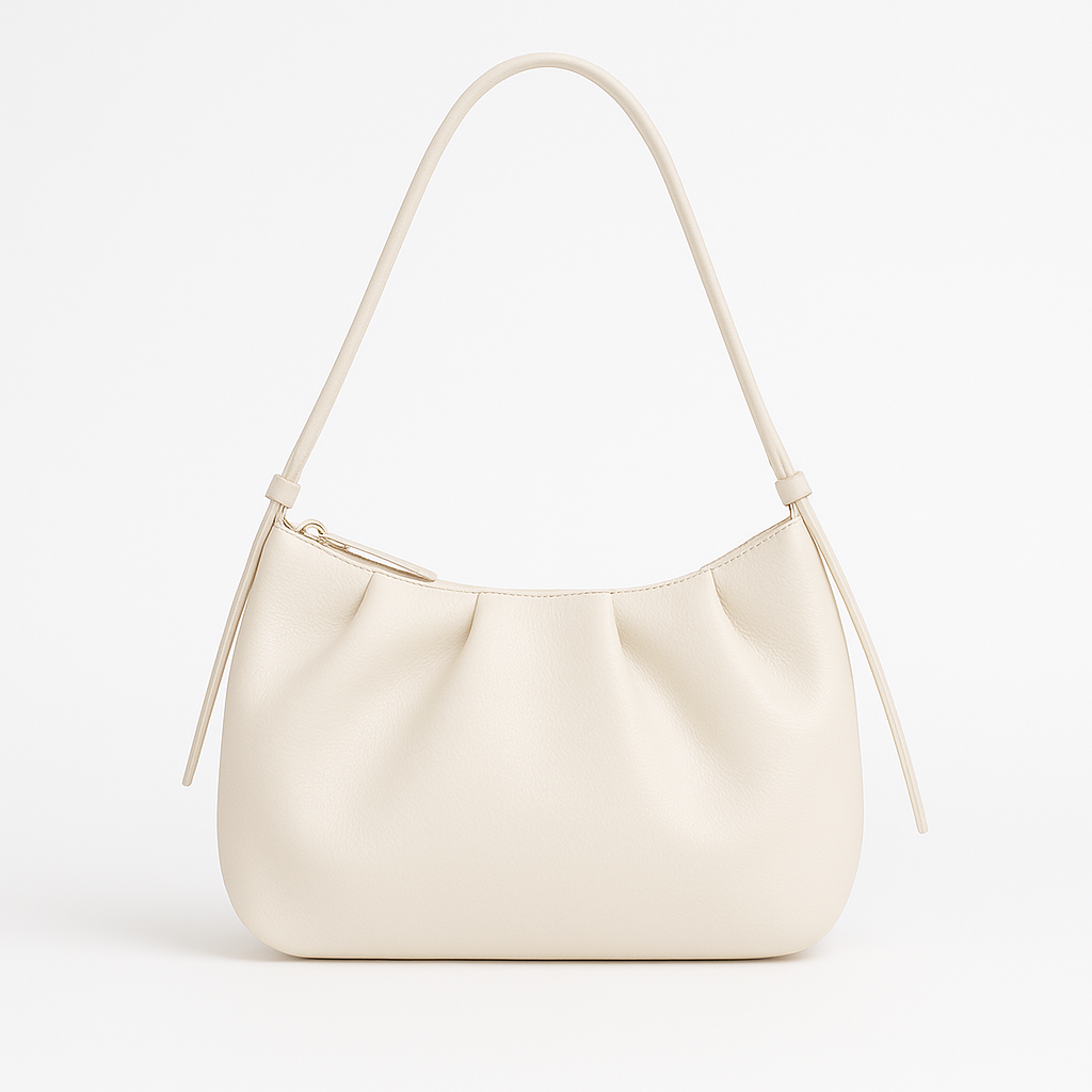Small structured shoulder bag with a short strap.