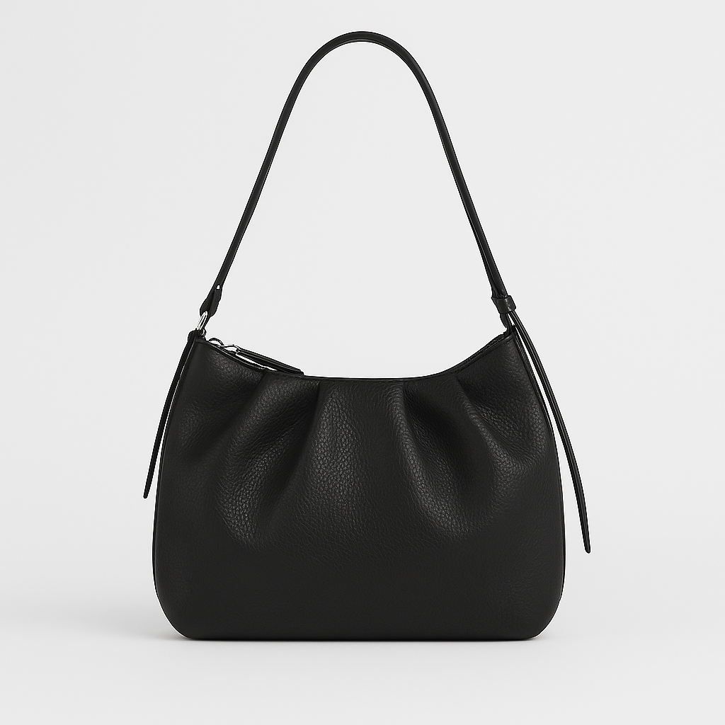Small structured shoulder bag with a short strap.
