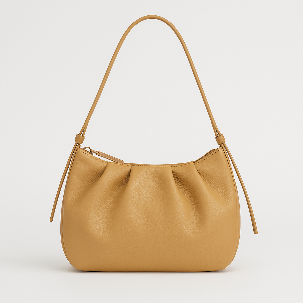 Small structured shoulder bag with a short strap.