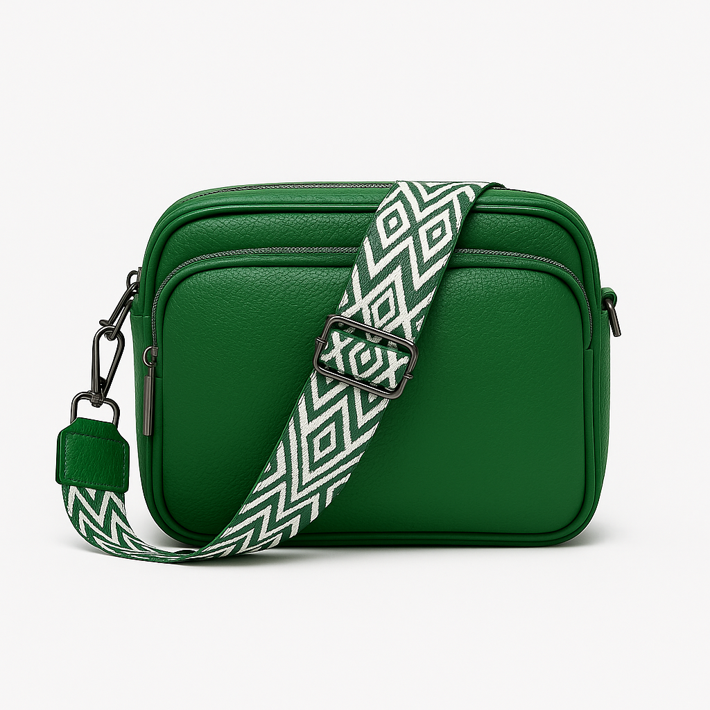 Crossbody bag with zip pocket and patterned strap.