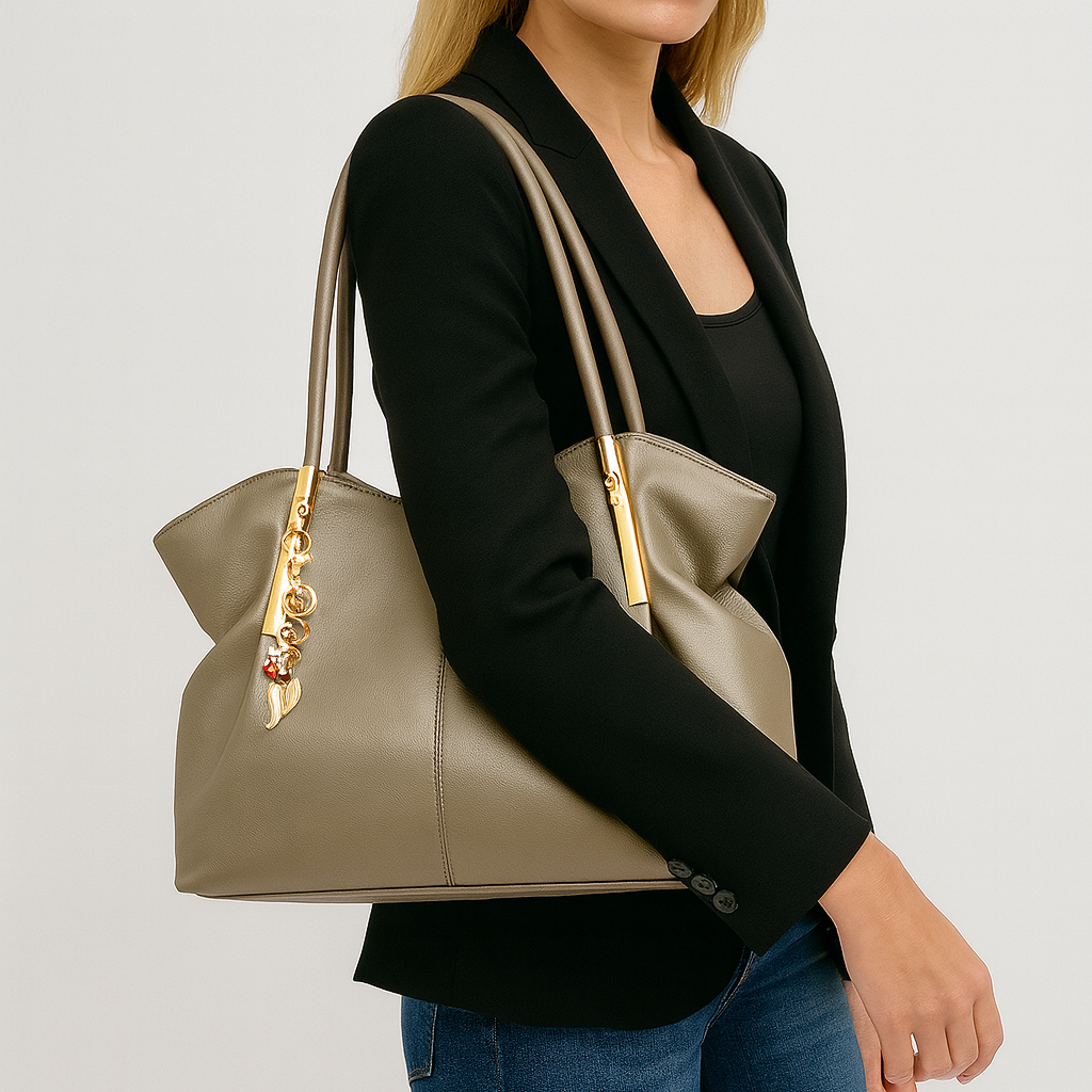 Large soft tote bag with double handles and decorative gold charms.